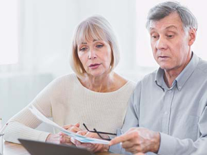 Older couple reviewing reverse mortgage